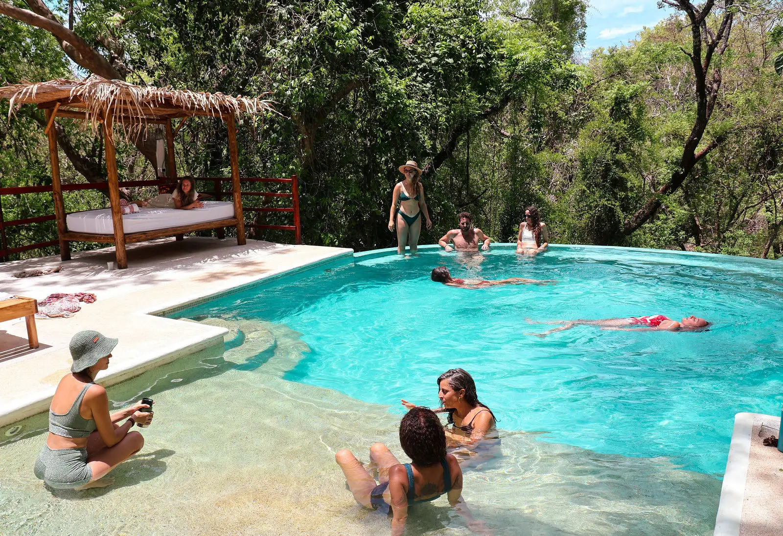 A group together in the pool at Naya Nosara